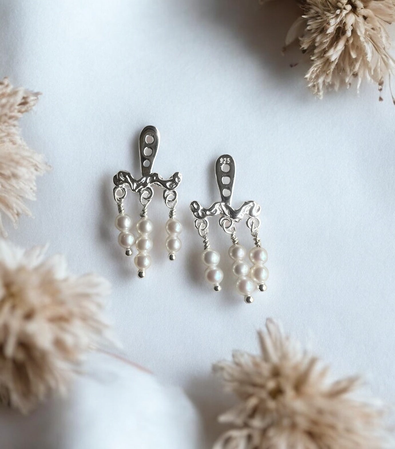 Clara behind ear, sølv